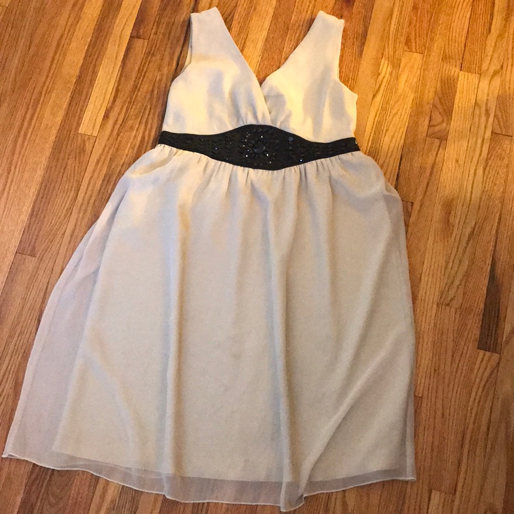 Tan dress with black embellishments